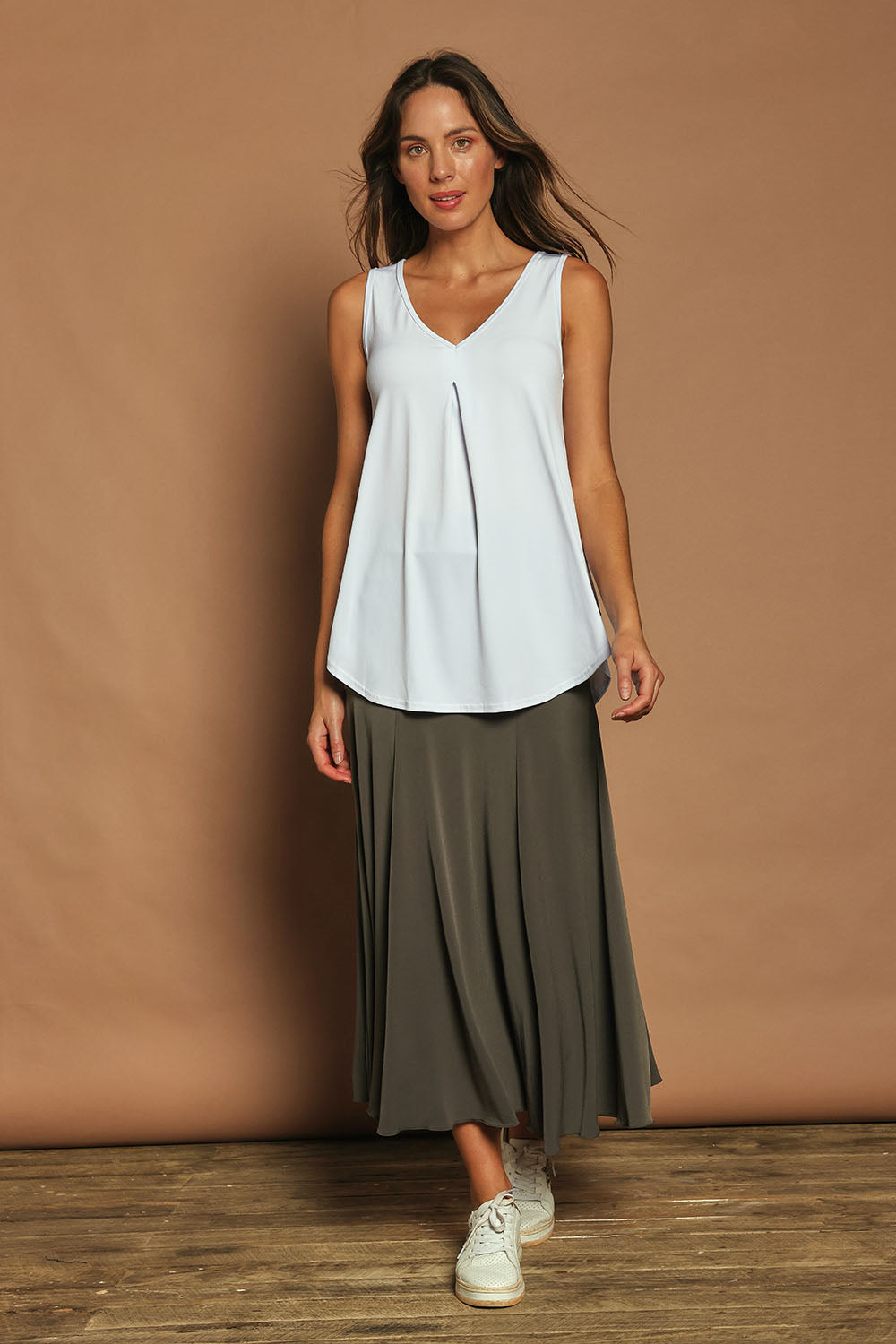 Model Madeline wearing size 10 of The Wanderer In Me Travel Skirt in colour Khaki (Green), from the front, showing the whole outfit