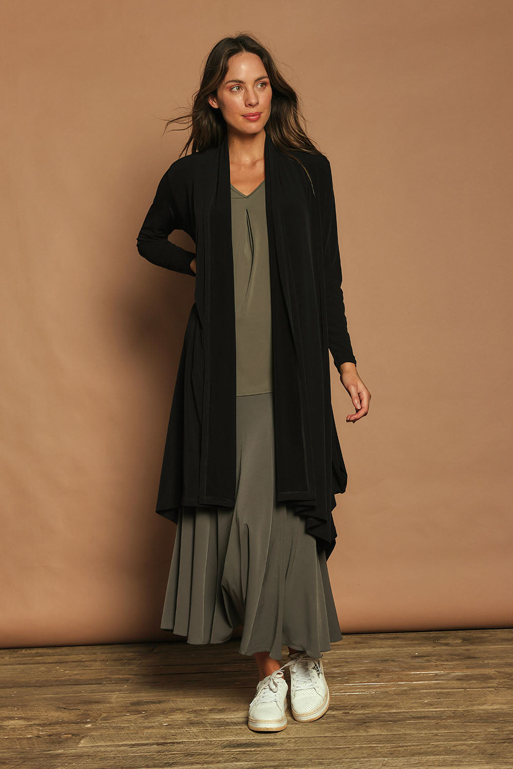 Model Madeline wearing size 10 of The Wanderer In Me Travel Skirt in colour Khaki (Green), from the front, showing the whole outfit