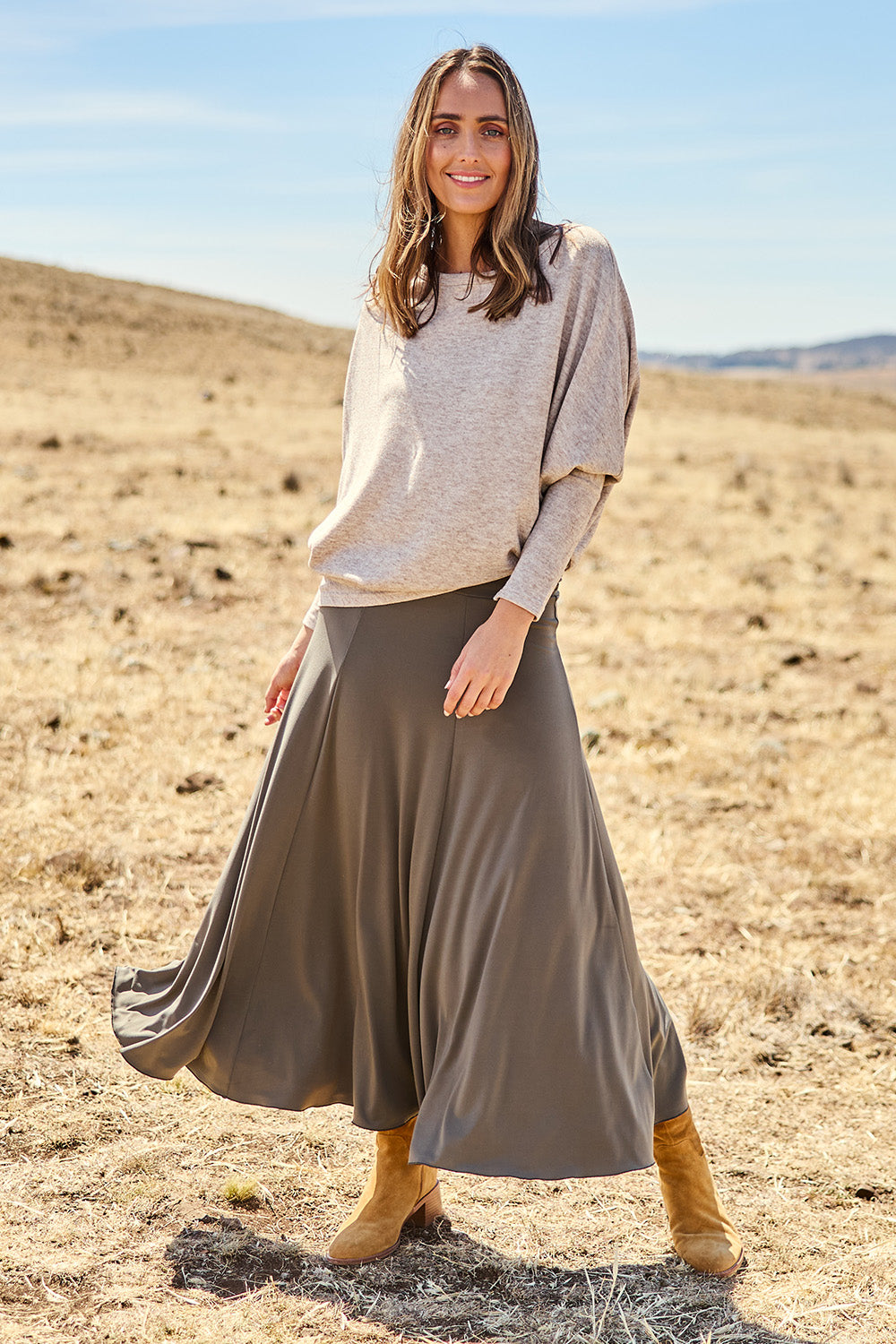 Model Tegan wearing size 10 of The Wanderer In Me Travel Skirt in colour Khaki (Green), from the front, showing the whole outfit