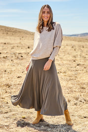 Model Tegan wearing size 10 of The Wanderer In Me Travel Skirt in colour Khaki (Green), from the front, showing the whole outfit