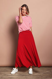 Model Riina wearing size 10 of The Wanderer In Me Travel Skirt in colour Redhot (Red), from the front, showing the whole outfit