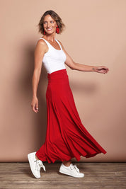 Model Riina wearing size 10 of The Wanderer In Me Travel Skirt in colour Redhot (Red), from the front, showing the whole outfit