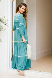 Model Ilona wearing size 10 of The Layers Of Love Maxi Dress in colour Moss (Green), from the front, showing the whole outfit