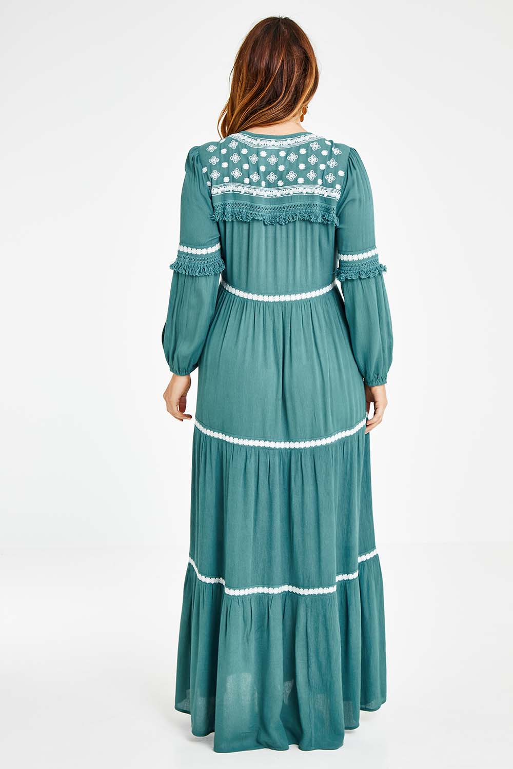 Model Laura wearing size 14 of The Layers Of Love Maxi Dress in colour Moss (Green), from the back