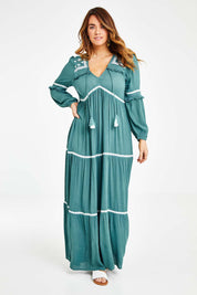 Model Laura wearing size 14 of The Layers Of Love Maxi Dress in colour Moss (Green), from the front, showing the whole outfit
