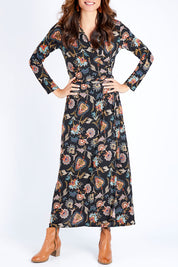 Model Ilona wearing size 10 of the Life Is Beautiful Wrap Maxi Dress in colour Blkfleur (Black), from the front, cropped image