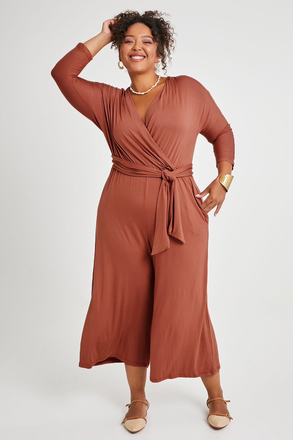 Model Alexis wearing size 16 of the Stylish Comfort Bamboo Jumpsuit in colour Copper, from the front, showing the whole outfit