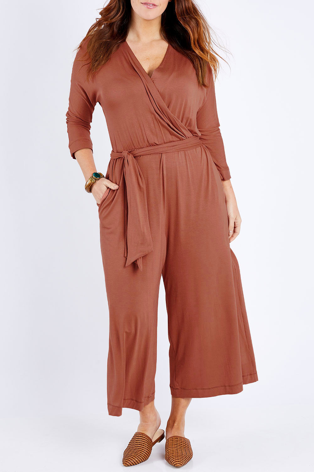 Model Laura wearing size 14 of the Stylish Comfort Bamboo Jumpsuit in colour Copper, from the front, cropped image