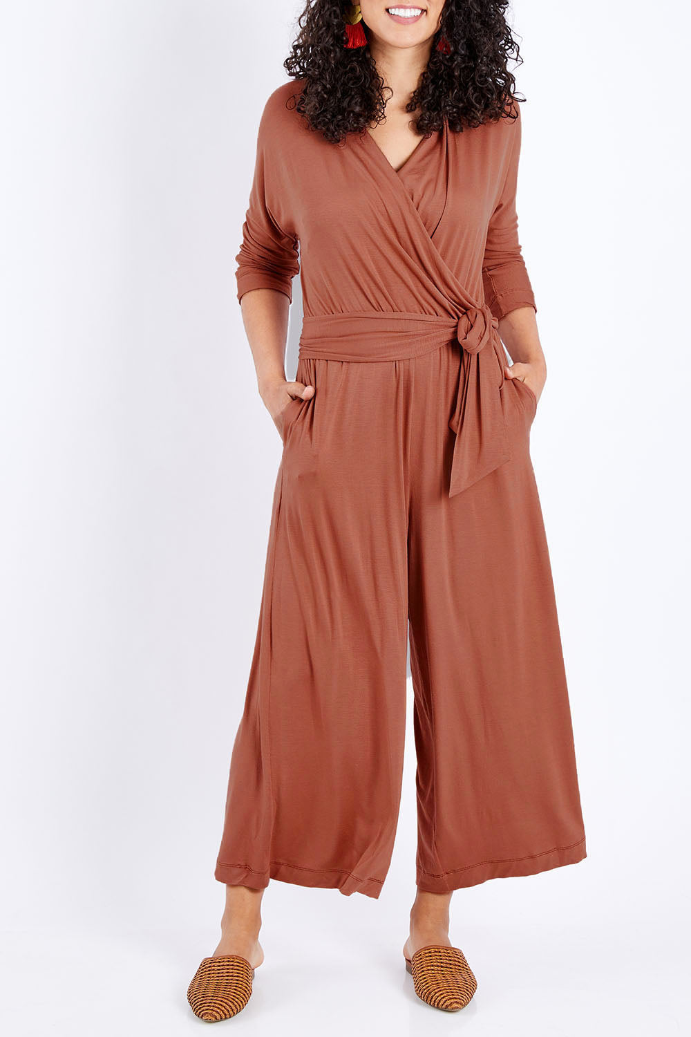 Model Pamela wearing size 10 of the Stylish Comfort Bamboo Jumpsuit in colour Copper, from the front, cropped image