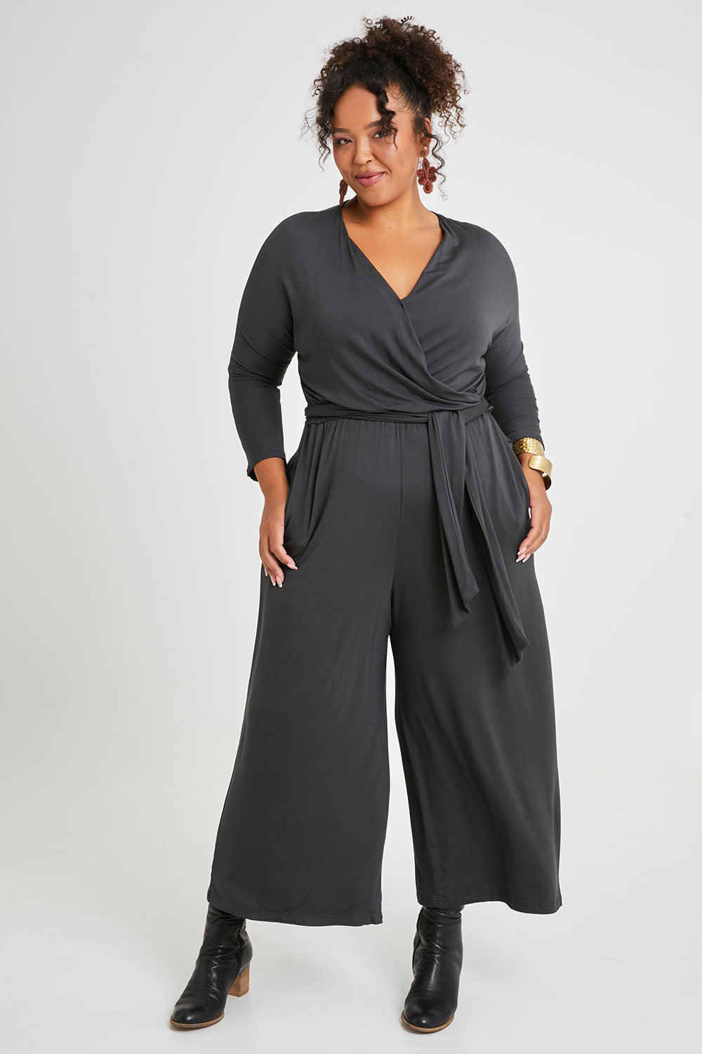 Model Alexis wearing size 16 of the Stylish Comfort Bamboo Jumpsuit in colour Storm (Black), from the front, showing the whole outfit