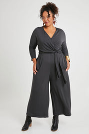 Model Alexis wearing size 16 of the Stylish Comfort Bamboo Jumpsuit in colour Storm (Black), from the front, showing the whole outfit