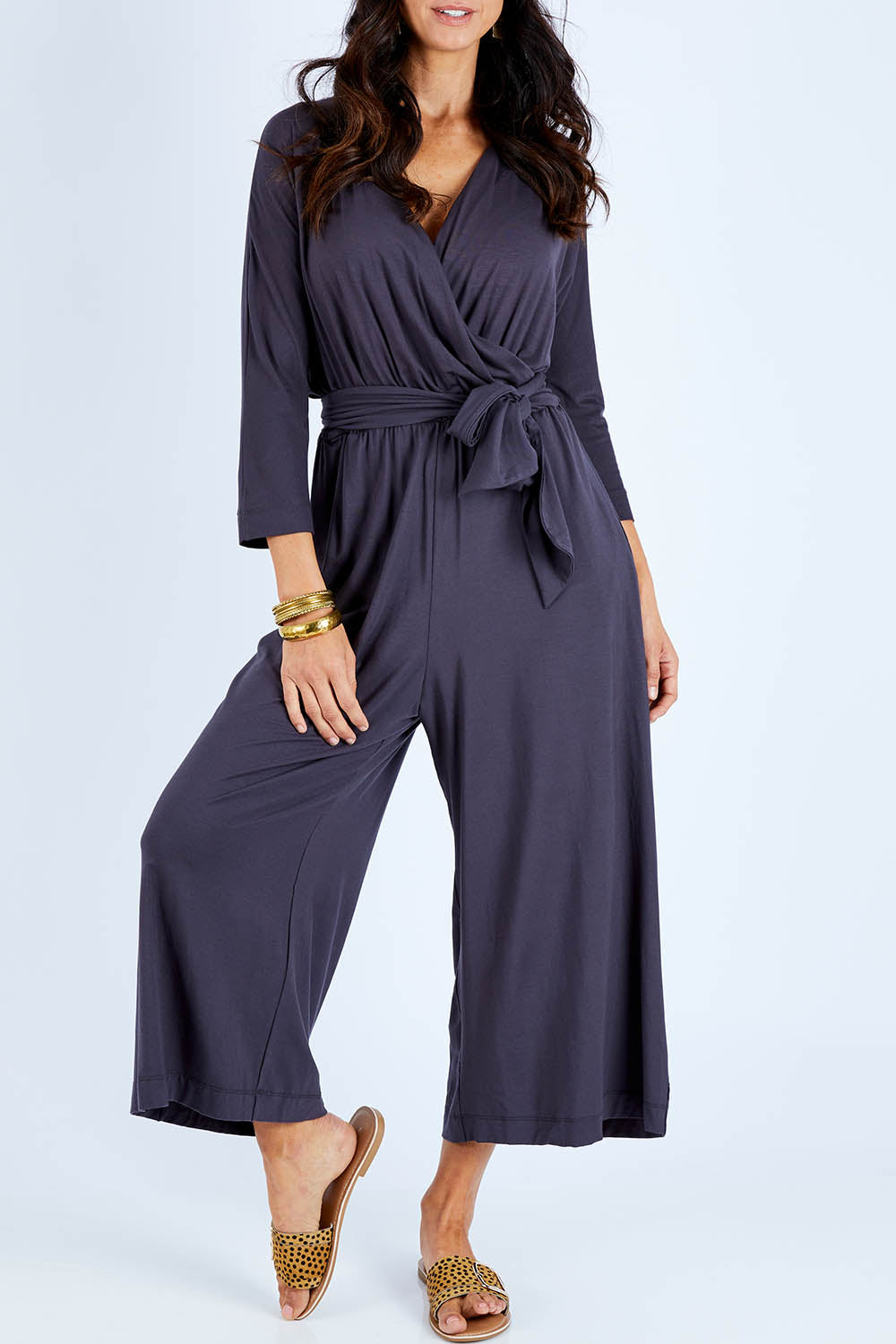 Model Gemma wearing size 10 of the Stylish Comfort Bamboo Jumpsuit in colour Storm (Black), from the front, cropped image