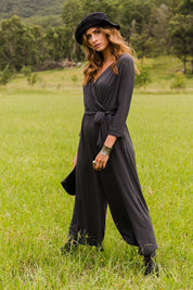 Model Ilona wearing size 10 of the Stylish Comfort Bamboo Jumpsuit in colour Storm (Black), from the front, showing the whole outfit