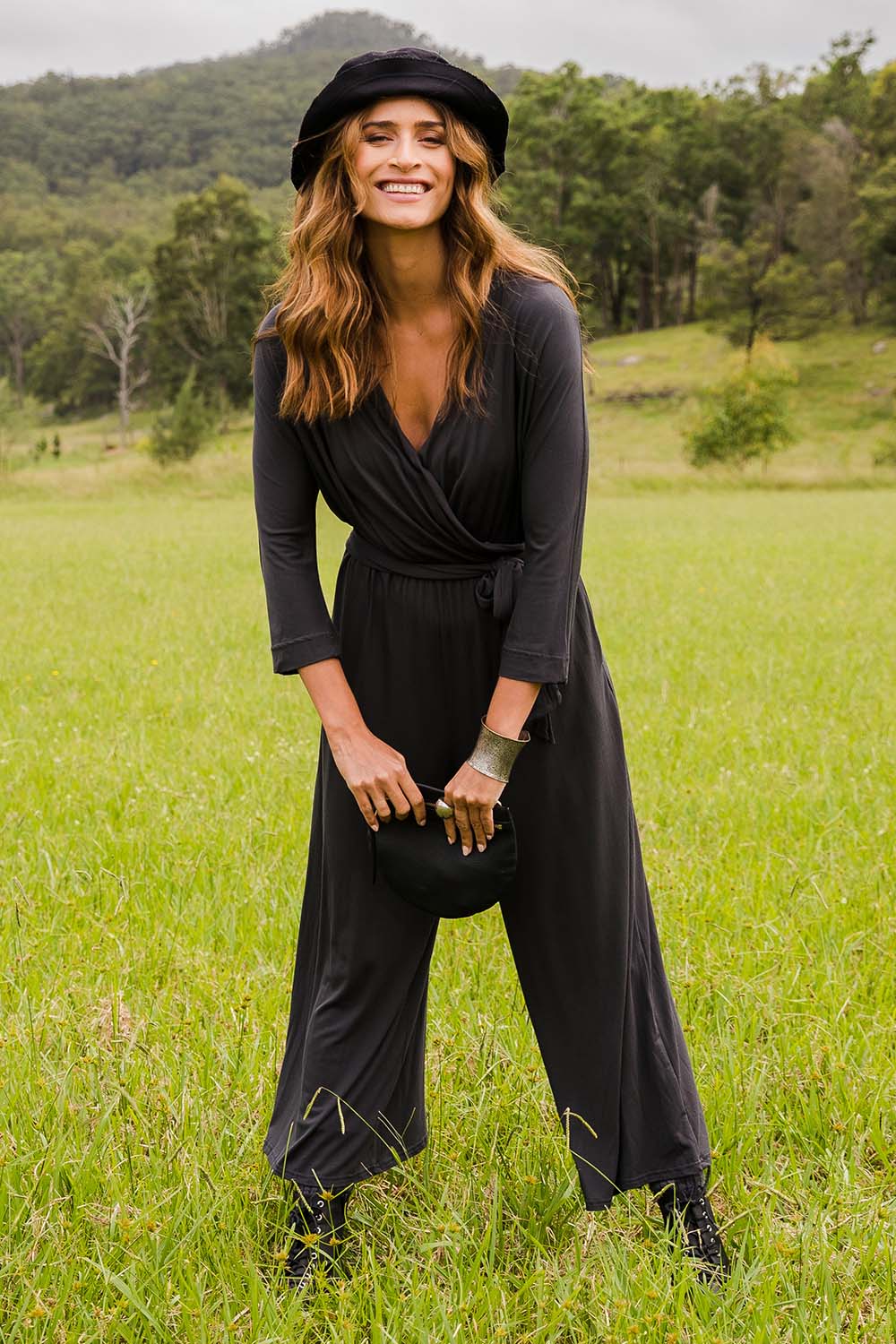 Model Ilona wearing size 10 of the Stylish Comfort Bamboo Jumpsuit in colour Storm (Black), from the front, showing the whole outfit