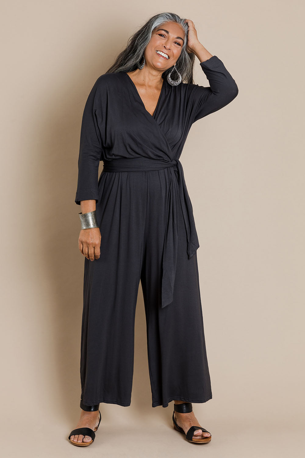Model Nadine wearing size 10 of the Stylish Comfort Bamboo Jumpsuit in colour Storm (Black), from the front, showing the whole outfit