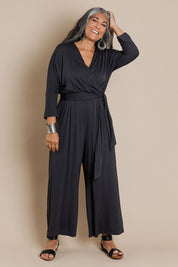 Model Nadine wearing size 10 of the Stylish Comfort Bamboo Jumpsuit in colour Storm (Black), from the front, showing the whole outfit