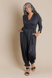 Model Nadine wearing size 10 of the Stylish Comfort Bamboo Jumpsuit in colour Storm (Black), from the front, showing the whole outfit