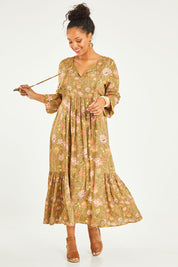 Model Noli wearing the Its Better With You Dress in colour Khaki (Green), from the front, showing the whole outfit