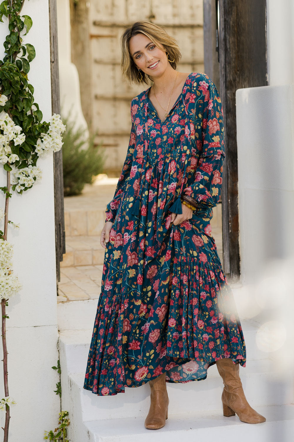 Model Tegan wearing size 10 of the Its Better With You Dress in colour Tealfleur (Blue), from the front, showing the whole outfit