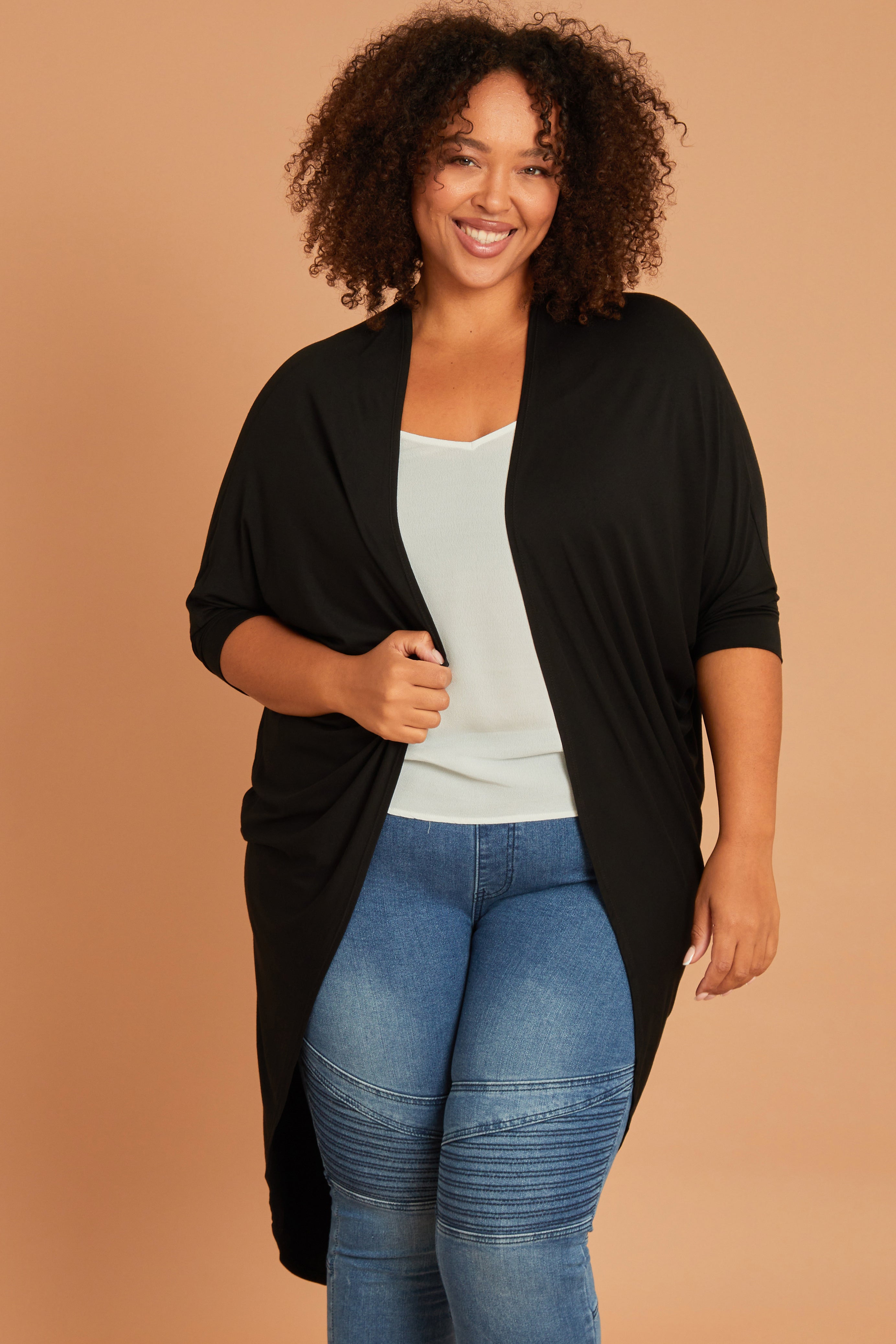 Model Alexis wearing size 16 of the Falling For You Bamboo Cardi in colour Black (Black), from the front, cropped image