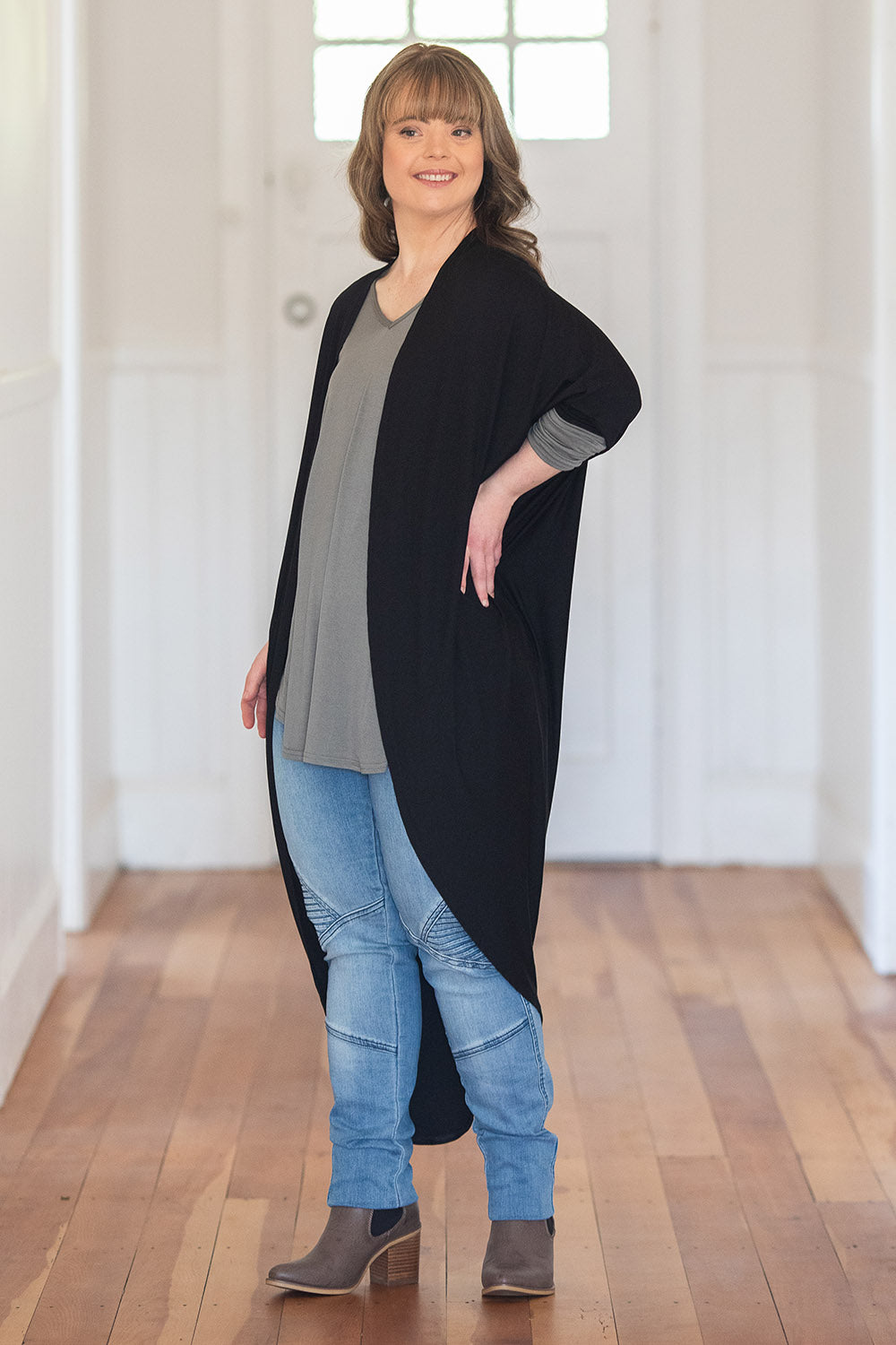 Model Katie wearing size 10 of the Falling For You Bamboo Cardi in colour Black (Black), from the front, showing the whole outfit