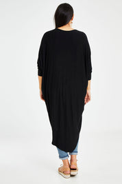 Model Sasha-Lee wearing size 16 of the Falling For You Bamboo Cardi in colour Black (Black), from the back