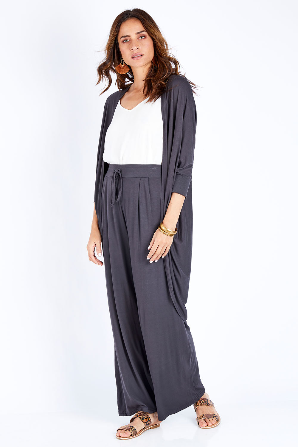 Model Ilona wearing size 10 of the Falling For You Bamboo Cardi in colour Storm (Black), from the front, showing the whole outfit