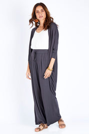 Model Ilona wearing size 10 of the Falling For You Bamboo Cardi in colour Storm (Black), from the front, showing the whole outfit
