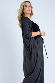 Model Jess wearing size 14 of the Falling For You Bamboo Cardi in colour Storm (Black), from the front, cropped image