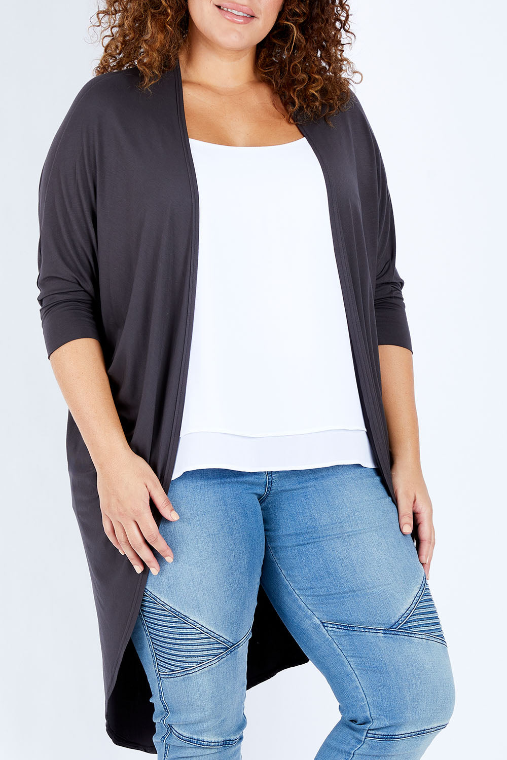 Model Jess wearing size 16 of the Falling For You Bamboo Cardi in colour Storm (Black), from the front, cropped image