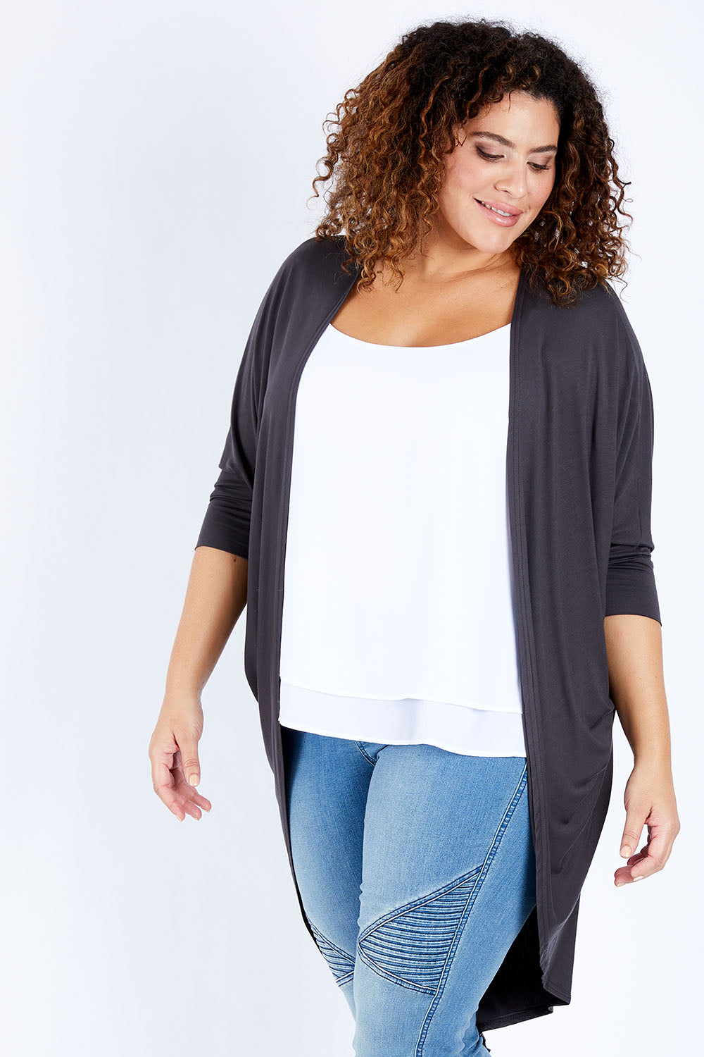 Model Jess wearing size 16 of the Falling For You Bamboo Cardi in colour Storm (Black), from the front, cropped image