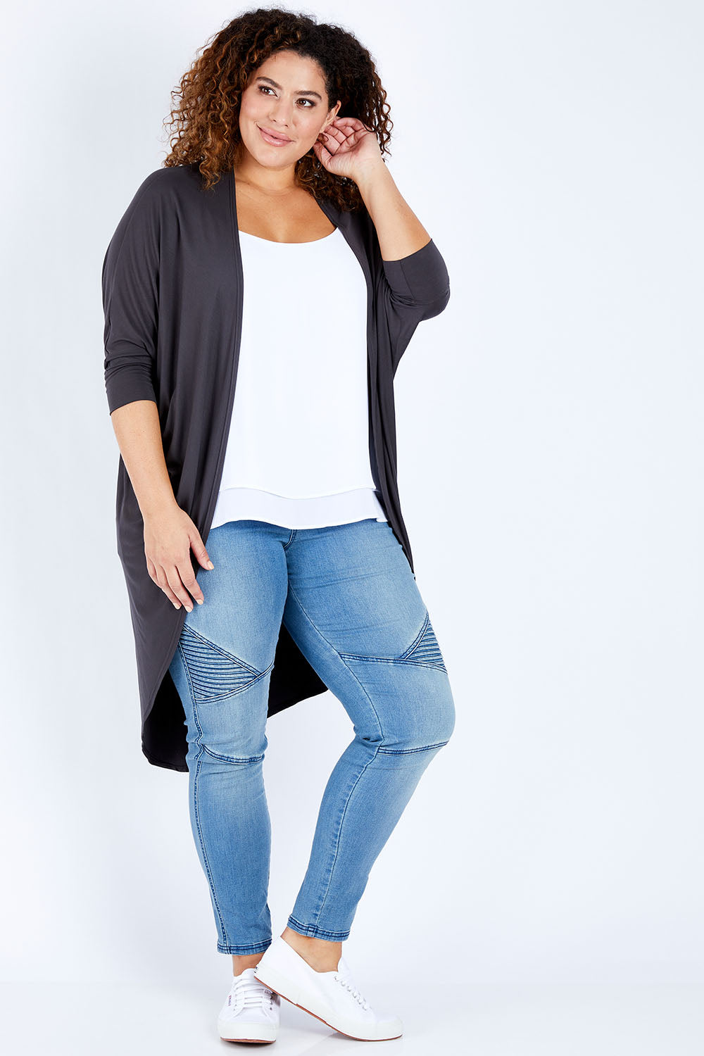 Model Jess wearing size 16 of the Falling For You Bamboo Cardi in colour Storm (Black), from the front, showing the whole outfit