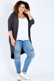 Model Jess wearing size 16 of the Falling For You Bamboo Cardi in colour Storm (Black), from the front, showing the whole outfit