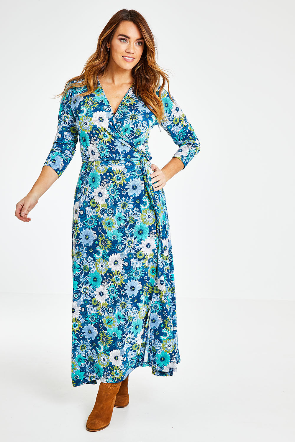 Model Laura wearing size 14 of the Life Is Beautiful Wrap Maxi Dress in colour Bluefleur (Blue), from the front, showing the whole outfit