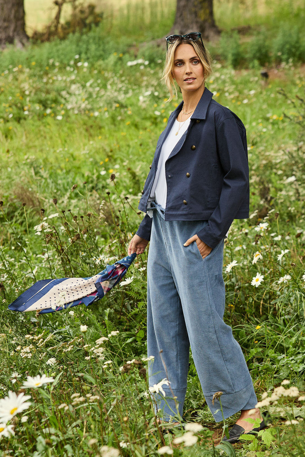 Model Tegan wearing size 10 of the Ready For You Cord Pants in colour Blue (Blue), from the front, showing the whole outfit