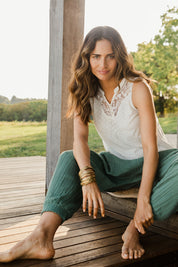 Model Ilona wearing size 10 of the Summer Flower Tank in colour White (White), from the front, showing the whole outfit