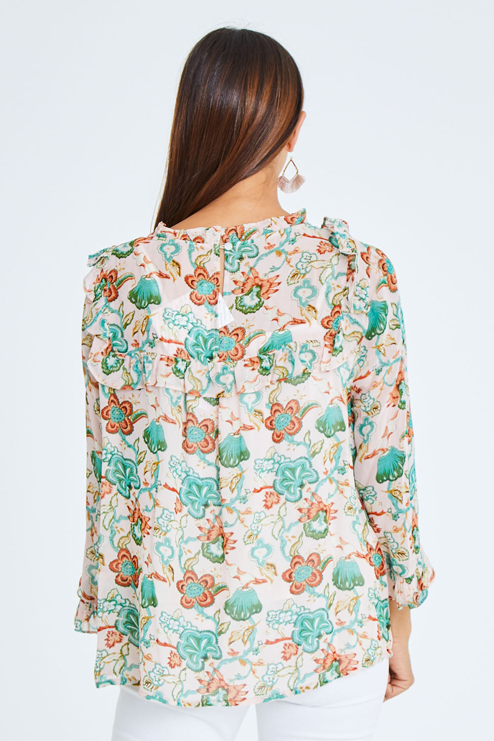 Model Cara wearing size 10 of the Meet Me At Midnight Blouse in colour Pastel (Pink), from the back