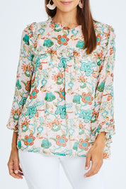 Model Cara wearing size 10 of the Meet Me At Midnight Blouse in colour Pastel (Pink), from the front, cropped image