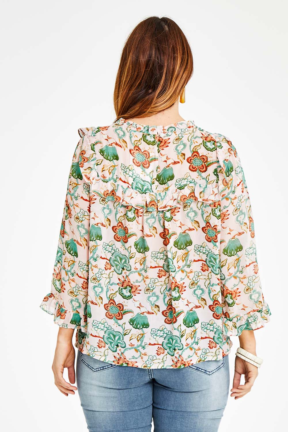 Model Laura wearing size 14 of the Meet Me At Midnight Blouse in colour Pastel (Pink), from the back