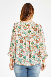 Model Laura wearing size 14 of the Meet Me At Midnight Blouse in colour Pastel (Pink), from the back