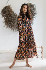 Model Ilona wearing size 10 of the Meet Me At Midnight Dress in colour Blkfleur (Black), from the front, showing the whole outfit