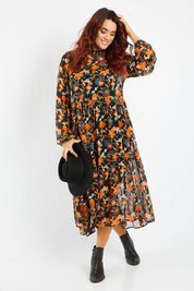 Model Laura wearing size 14 of the Meet Me At Midnight Dress in colour Blkfleur (Black), from the front, showing the whole outfit