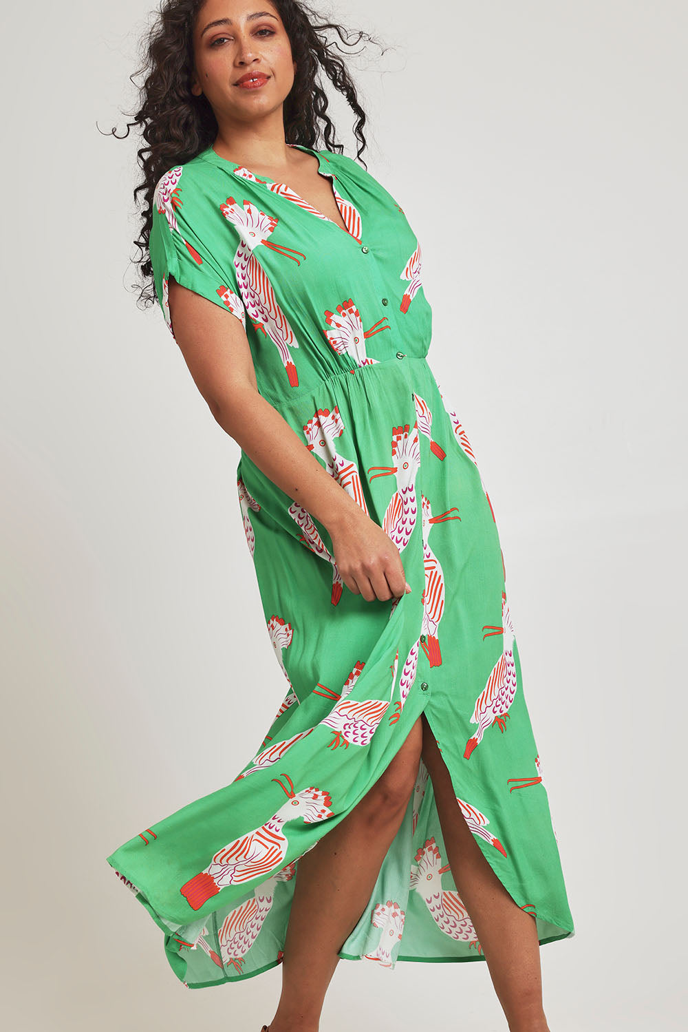 Model Terri-Leigh wearing size 14 of the Wild Garden Maxi Dress in colour Emerald (Green), from the front, cropped image