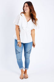 Model Laura wearing size 14 of the Wild Heart Embroidered Blouse in colour Milk (White), from the front, showing the whole outfit