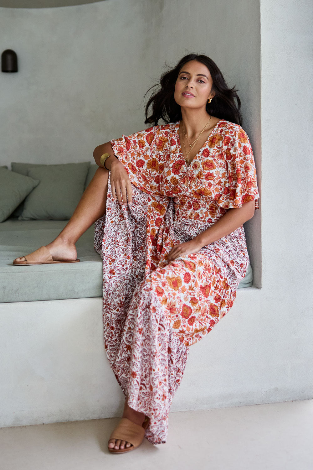 Model Tahnee wearing size 10 of the Tiers Of Joy Maxi Dress in colour Coralfleur, from the front, showing the whole outfit