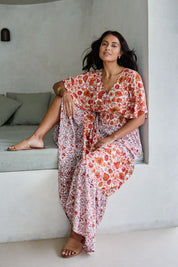 Model Tahnee wearing size 10 of the Tiers Of Joy Maxi Dress in colour Coralfleur, from the front, showing the whole outfit