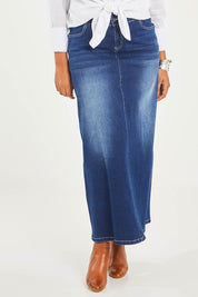 Model Noli wearing size 14 of the Dusty Footprints Skirt in colour DarkDenim (Blue), from the front, cropped image
