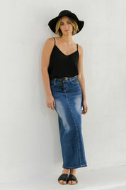 Model Tegan wearing size 8 of the Dusty Footprints Skirt in colour DarkDenim (Blue), from the front, showing the whole outfit