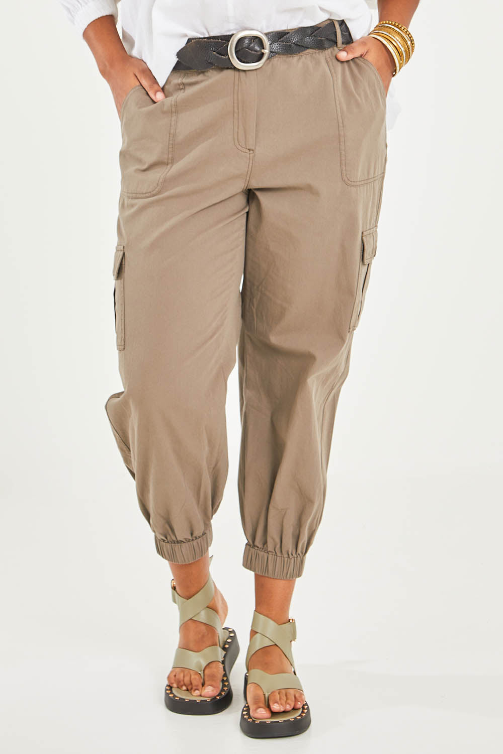 Model Noli wearing size 14 of the Travel With You Cargo Pants in colour Castle, from the front, cropped image