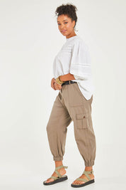 Model Noli wearing size 14 of the Travel With You Cargo Pants in colour Castle, from the front, showing the whole outfit